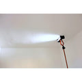 Edma cordless LED inspection light angled upward to light a ceiling
